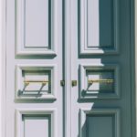 Closed double doors representing Jesus Is The Door through whom we enter eternal life and salvation.