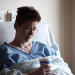 Woman in a hospital bed facing uncertainty, reflecting the need to trust God Our Guide for direction, peace, and wisdom