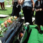 Funeral service beside a casket, reflecting humanity’s longing for eternal life and pointing to Jesus, the Immortal Lord, who gives everlasting life.