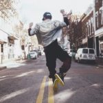 Person joyfully jumping in the street, reflecting the excitement and praise believers have because God Is My Inheritance and eternal hope is found in Christ.