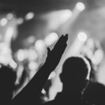 Hand raised in worship, reflecting on The LORD who alone deserves our praise and glory.