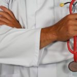 Doctor holding a stethoscope, reflecting on Jesus as the great Physician who offers healing and eternal hope.