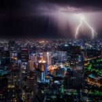 Lightning storm over a city, illustrating life’s storms and the truth that God is our refuge in times of fear and trouble.