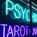 Neon psychic and tarot sign, contrasting with Jesus, God’s prophet, who speaks truth and guides us through His Word.