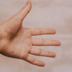Open hand reaching outward, representing Jesus separated from sinners who came to save us and reunite us with God.