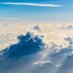 Clouds shifting from darkness into bright light, illustrating how Jesus is my rescuer who brings me from darkness into His kingdom of light.