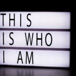 Lightbox sign reading “This Is Who I Am,” reflecting the confession that Jesus the Christ is the Son of the living God.