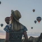 Woman looking toward the sky representing hope and confidence that God’s Love Endures Forever through every change in life.