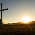 Cross at sunrise, reflecting on the Lord Who Provides through Jesus, the Holy Spirit, and His Word.