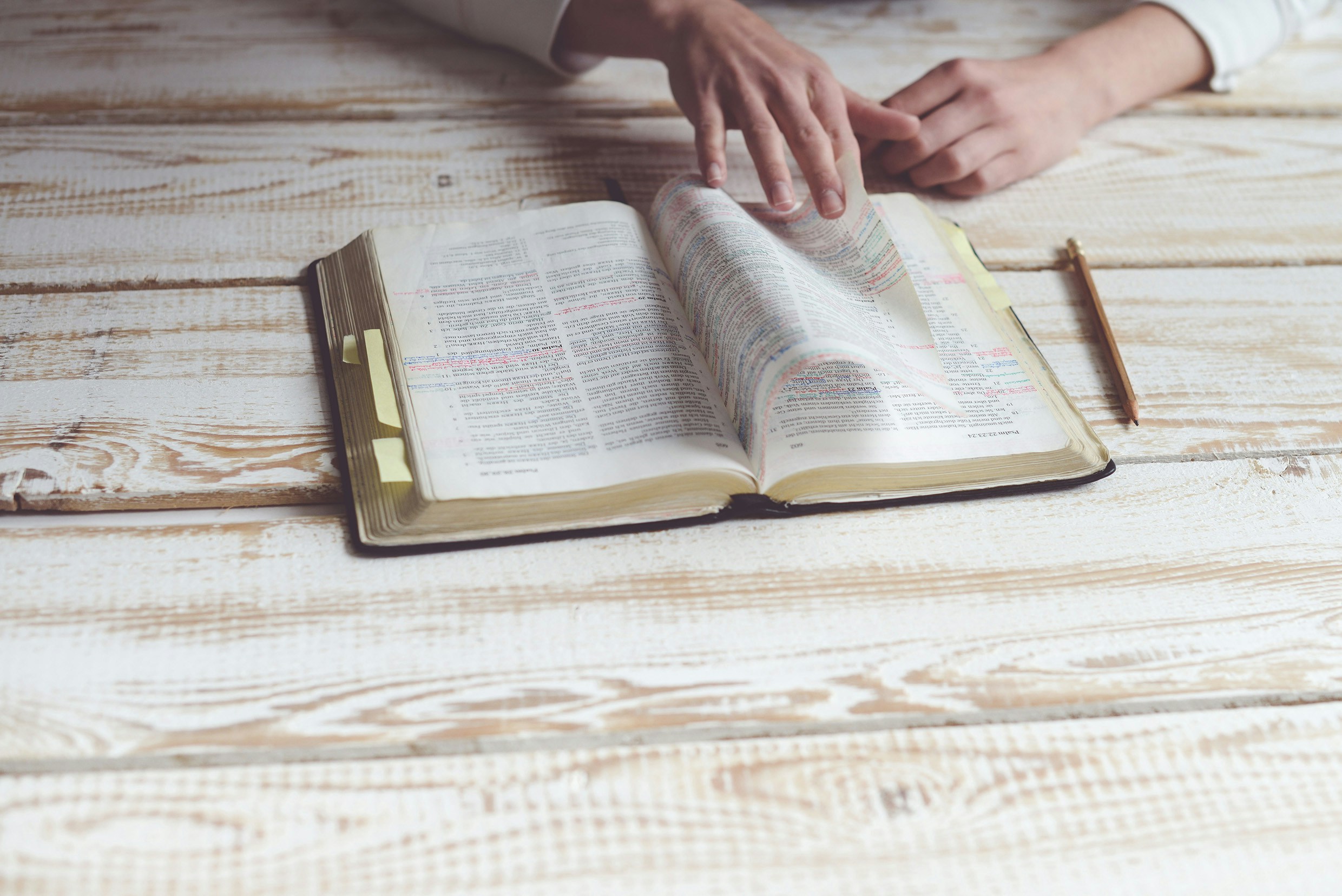 Open Bible on a table.