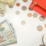 Money and coins representing material prosperity, contrasting with Jesus, the prosperous one, who fulfilled God’s will and secured our salvation.