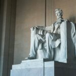 Statue of Abraham Lincoln seated in authority, illustrating that Jesus is the ruler of the kings of the earth above every earthly leader.