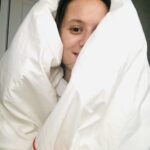 Person wrapped in a blanket, illustrating warmth and comfort, reflecting how God of All Comfort surrounds and cares for us in difficult times