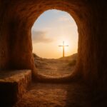 View from an empty tomb looking out to a cross at sunrise, reflecting Jesus as High and Lifted Up in victory and glory.