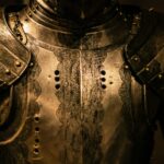 Close-up of a suit of armor representing the Armor of God and the importance of standing firm against spiritual battles.