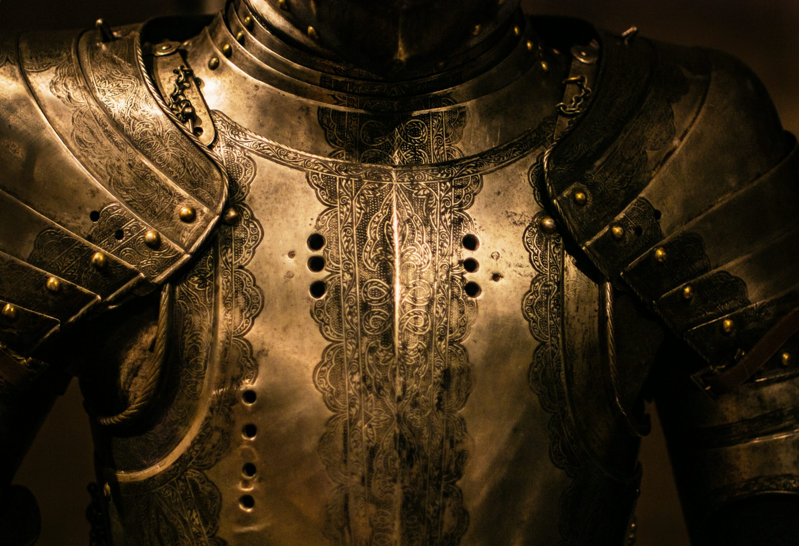 Close-up of a suit of armor representing the Armor of God and the importance of standing firm against spiritual battles.